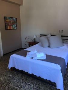Ένα ή περισσότερα κρεβάτια σε δωμάτιο στο Villa Lucia