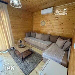 a living room with a couch and a table at Apartmani Konoba Starčevo in Virpazar