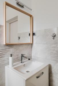 a bathroom with a white sink and a mirror at Willa Mazowiecka Jantar in Jantar +36 photos