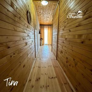 a hallway of a house with wooden walls at Apartmani Konoba Starčevo in Virpazar
