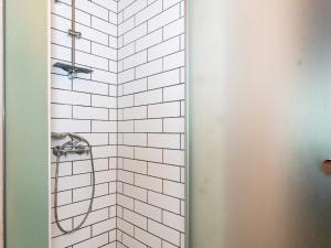 a bathroom with a shower with white tile at 6 person holiday home in Spøttrup-By Traum in Lihme +21 photos