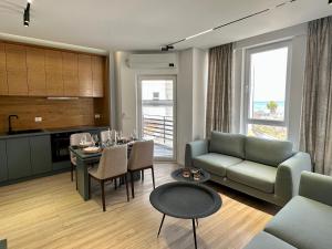 a living room with a couch and a table at SUV ApartHotel in Pogradec