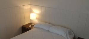 Postel nebo postele na pokoji v ubytování Cappuccio Hotel