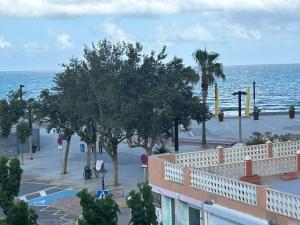 a view of the ocean from the balcony of a building at La caleta in Oropesa del Mar +3 photos