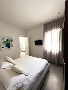 Postel nebo postele na pokoji v ubytování Petra Maris B&B