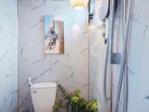 a bathroom with a shower and a toilet at Mơ Homestay Kê Gà (Mer Bleue Homestay) in Ke Ga +23 photos
