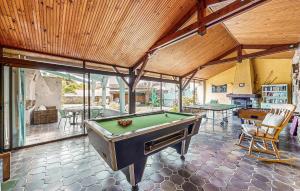 a room with a pool table and some tables at 4 Bedroom Stunning Home In Escos in Escos +26 photos