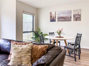 a living room with a couch and a table at Modern Berwick Home with Fast WiFi Garage in Berwick