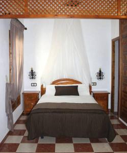 A bed or beds in a room at El Mirador