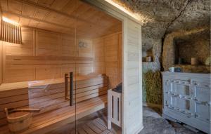 a sauna with a tub in a stone building at Villa Arzilla in Vitorchiano +74 photos