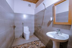a bathroom with a sink and a toilet at Healing Homestay Sapa in Sa Pa