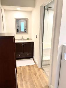 a bathroom with a sink and a mirror at Suite Dreams in Cedar City