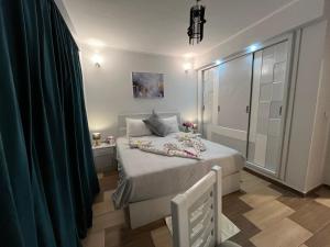 Letto o letti in una camera di PortghalibFlat