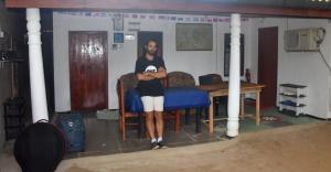a man standing in a room with his arms crossed at Meera Homestay & Guest House in Anuradhapura