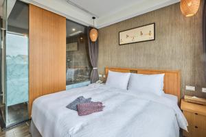 Ένα ή περισσότερα κρεβάτια σε δωμάτιο στο Tenlien onsen Hot Spring Hotel