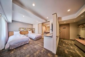 Postel nebo postele na pokoji v ubytování Hotel Flora Funabashi
