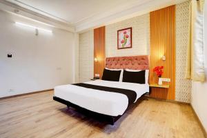 Postel nebo postele na pokoji v ubytování Super Hotel JP Palace