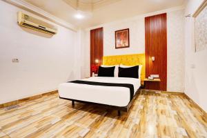 Postel nebo postele na pokoji v ubytování Super Hotel JP Palace