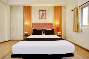 Postel nebo postele na pokoji v ubytování Super Hotel JP Palace