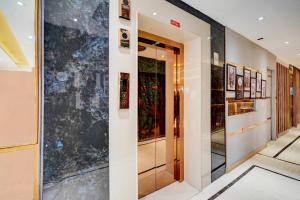Postel nebo postele na pokoji v ubytování Super Hotel JP Palace