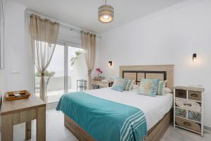 Posteľ alebo postele v izbe v ubytovaní PUNTA PLATA BEACH CENTER