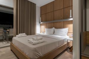 Elisavet Nuevo Studios & Suites客房内的一张或多张床位