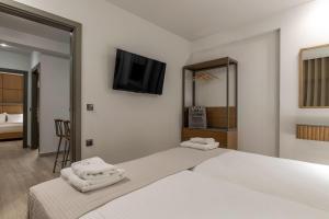 Elisavet Nuevo Studios & Suites客房内的一张或多张床位
