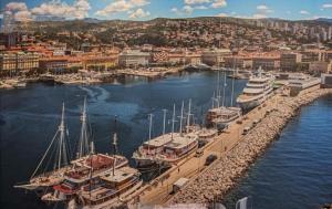 a group of boats docked in a marina at DOWNTOWN Fiume, underground Garage within the property in Rijeka