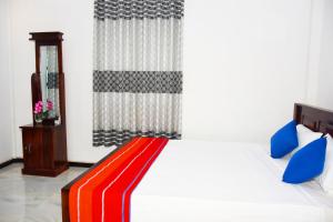 Postel nebo postele na pokoji v ubytování Sasanda Villa and Yala Safari Place