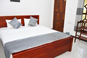 Postel nebo postele na pokoji v ubytování Sasanda Villa and Yala Safari Place