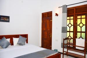 Postel nebo postele na pokoji v ubytování Sasanda Villa and Yala Safari Place