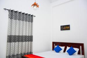 Postel nebo postele na pokoji v ubytování Sasanda Villa and Yala Safari Place
