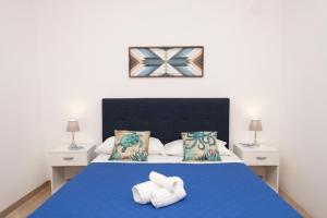 A bed or beds in a room at Appartamento Mia