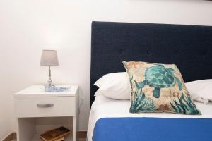 A bed or beds in a room at Appartamento Mia