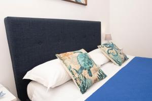 A bed or beds in a room at Appartamento Mia