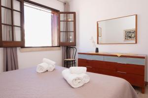 A bed or beds in a room at Appartamento Mia