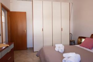 A bed or beds in a room at Appartamento Mia