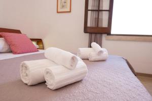 A bed or beds in a room at Appartamento Mia