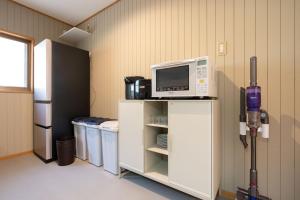 Eldhús eða eldhúskrókur á Max11名宿泊可能 一軒家を丸ごと貸切 BBQ可能 ファミリー歓迎 ANGO NASU I