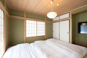 Rúm í herbergi á Max11名宿泊可能 一軒家を丸ごと貸切 BBQ可能 ファミリー歓迎 ANGO NASU I