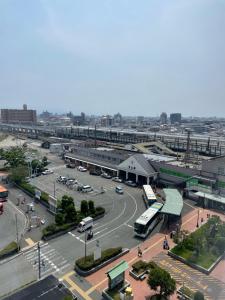 an aerial view of a parking lot with buses at Terminal Hotel Matsuyama in Matsuyama