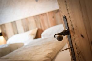 Postel nebo postele na pokoji v ubytování Stanzls - Lodge am Lech