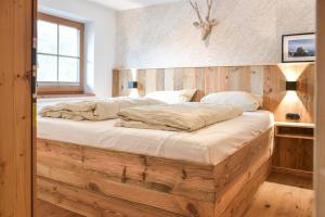 Postel nebo postele na pokoji v ubytování Stanzls - Lodge am Lech