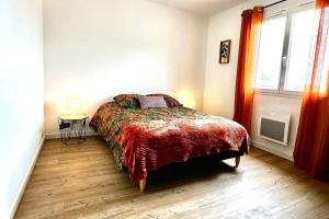 a bedroom with a bed and a window at Al País Del Mesturet in Graulhet +6 photos