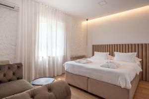 En eller flere senger på et rom på Nono Ban Hotel & Villa