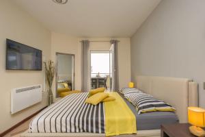 Posteľ alebo postele v izbe v ubytovaní Comfortable apartment near the beach