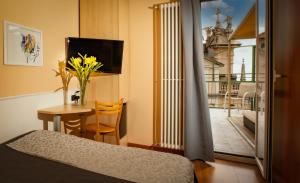 TV a/nebo společenská místnost v ubytování Hotel Vista Lago
