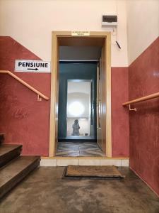 a room with stairs and a sign that reads feminism at Casa Heidi in Timişoara +38 photos