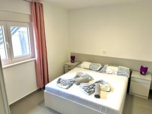 Postel nebo postele na pokoji v ubytování Vip Deluxe Apartment Arian