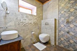 a bathroom with a sink and a toilet and a shower at WoodVista Cottages By Jomotel in Shimla +59 photos